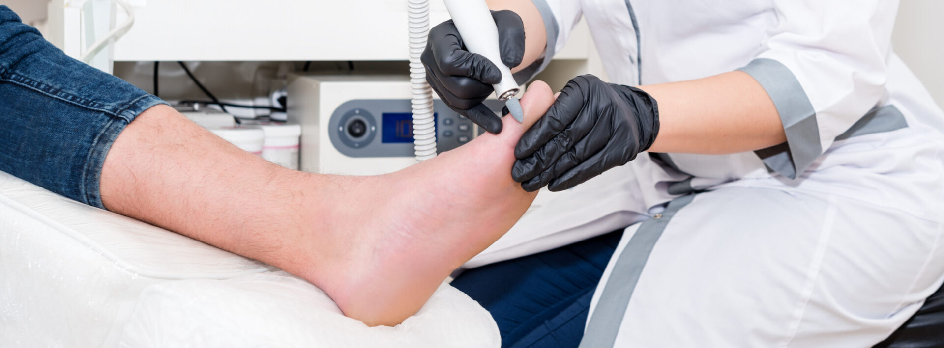 Nurse providing foot care services to client.